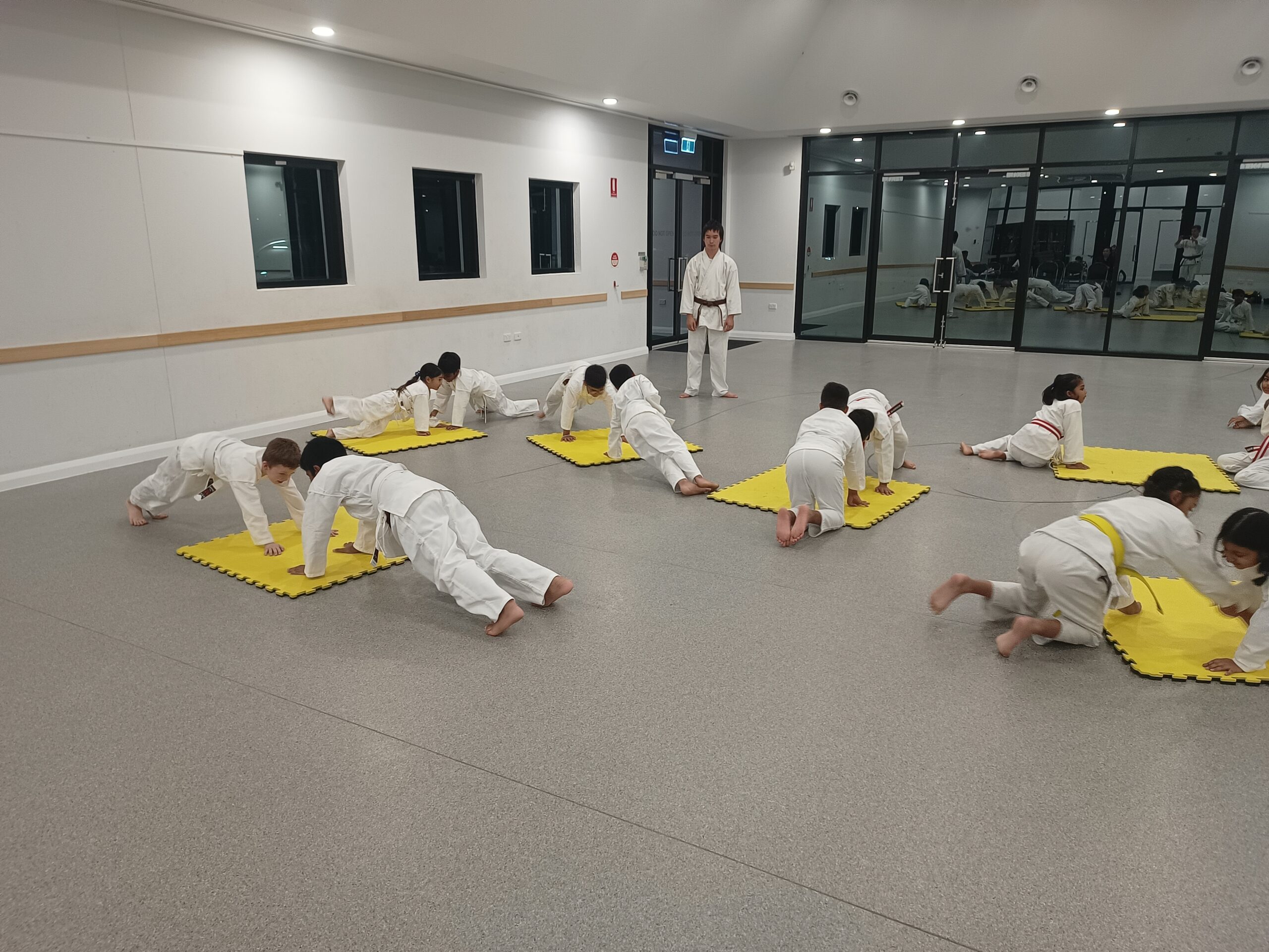 Kids using karate mats